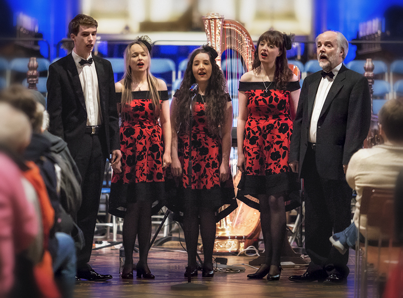 Classic Harmony: Frank, Rebecca, Orlaith, Emily and John Kelly standing as they perform in City Hall